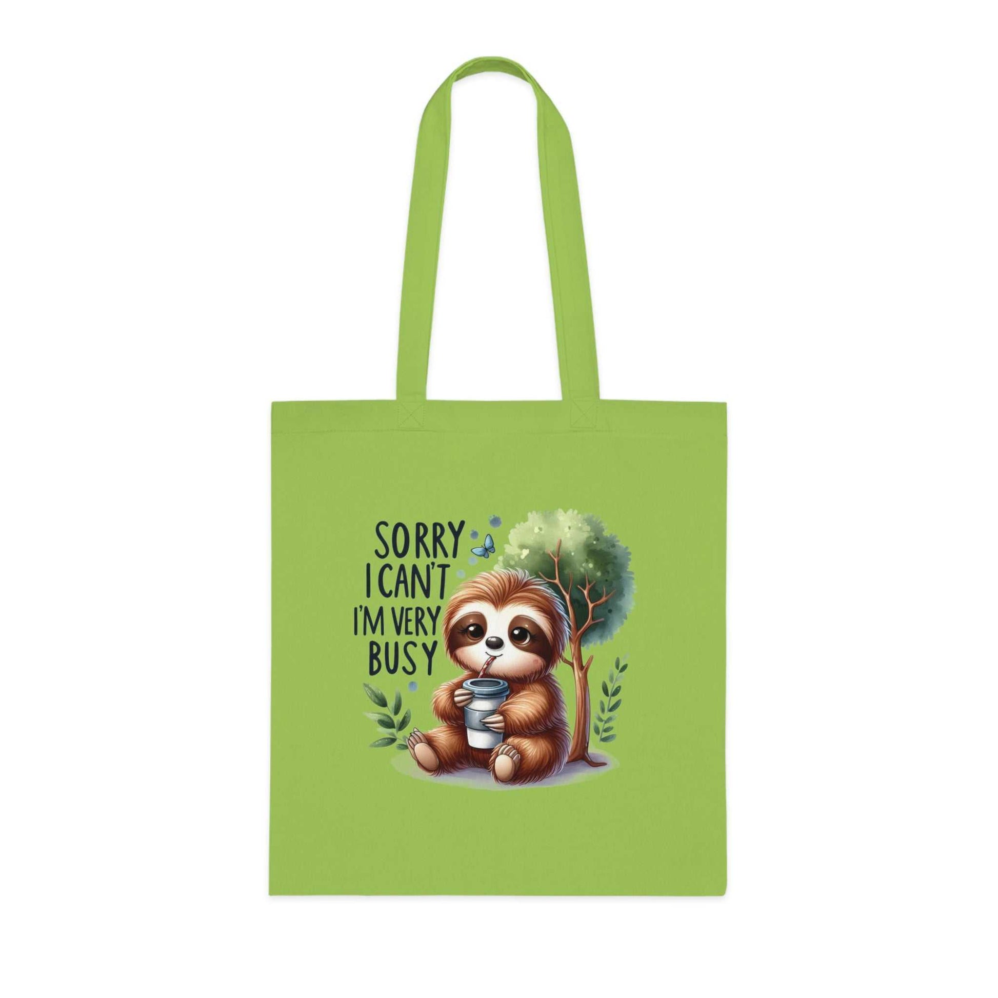 Cute sloth tote bag with fun vibrant design on green cotton fabric.