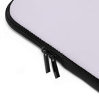 Close-up of lavender neoprene laptop sleeve with dual black zipper and soft foam lining for protection