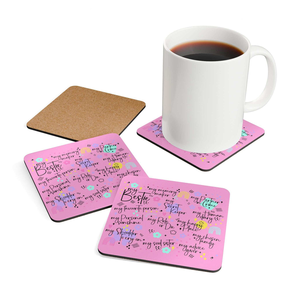 Pink coasters set with playful designs, cork backing, and coffee mug on top.