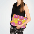 Woman holding retro floral laptop sleeve with pink and yellow flowers