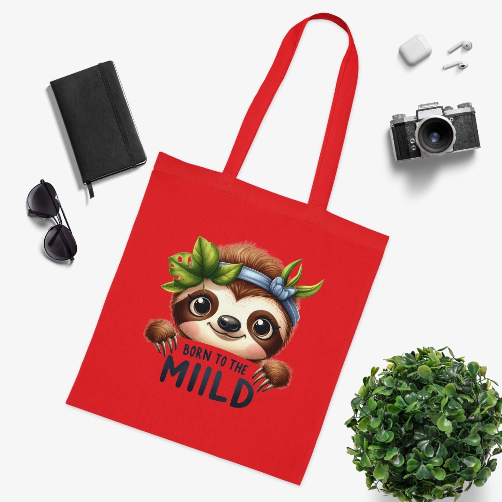 Red cotton tote bag featuring cute sloth design, ideal for sloth lovers.
