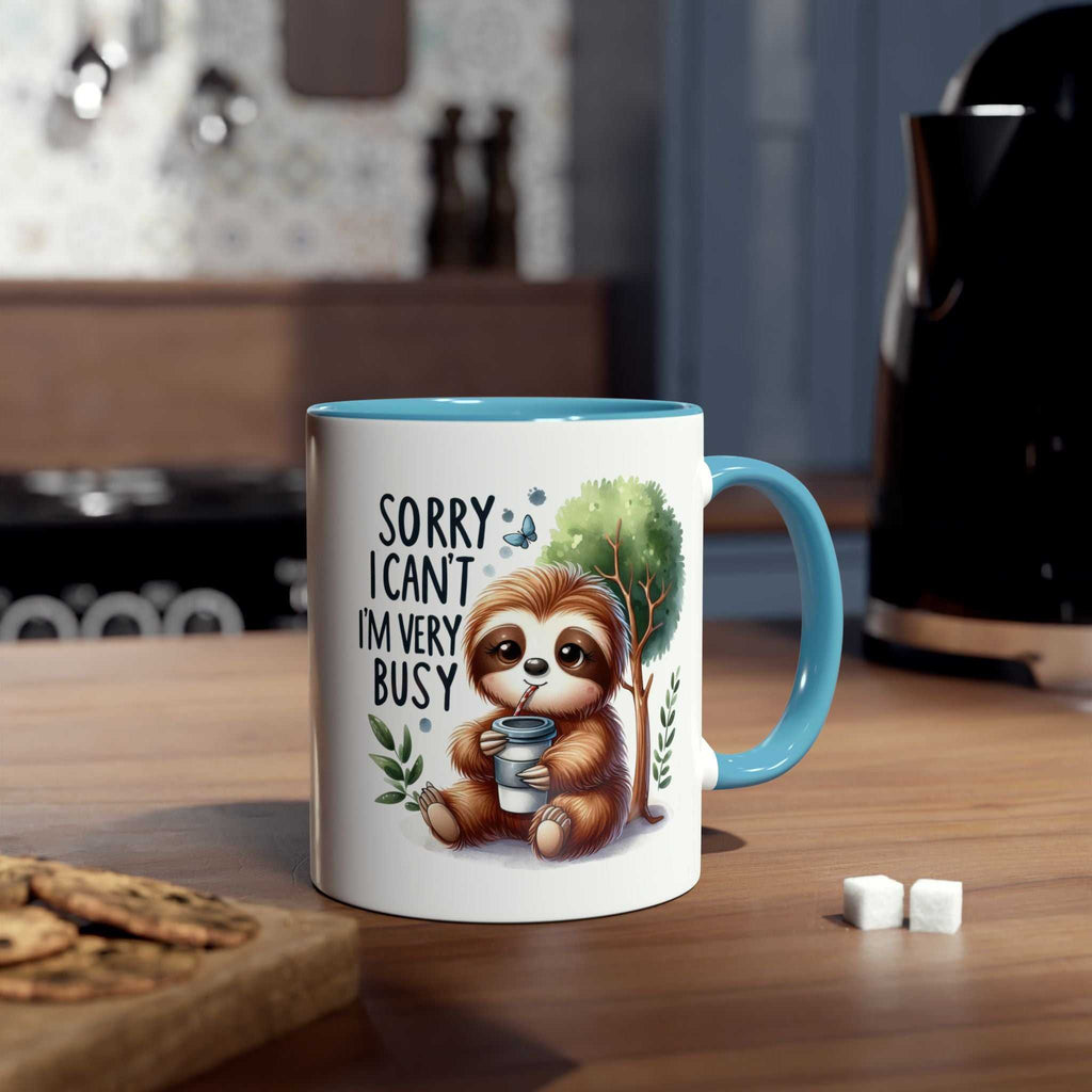 Cute sloth coffee mug with "Sorry I can't, I'm very busy" design, ideal for animal lovers, 11oz ceramic, microwave and dishwasher safe.