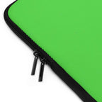 Close-up of lime green laptop sleeve with black dual zipper and neoprene material