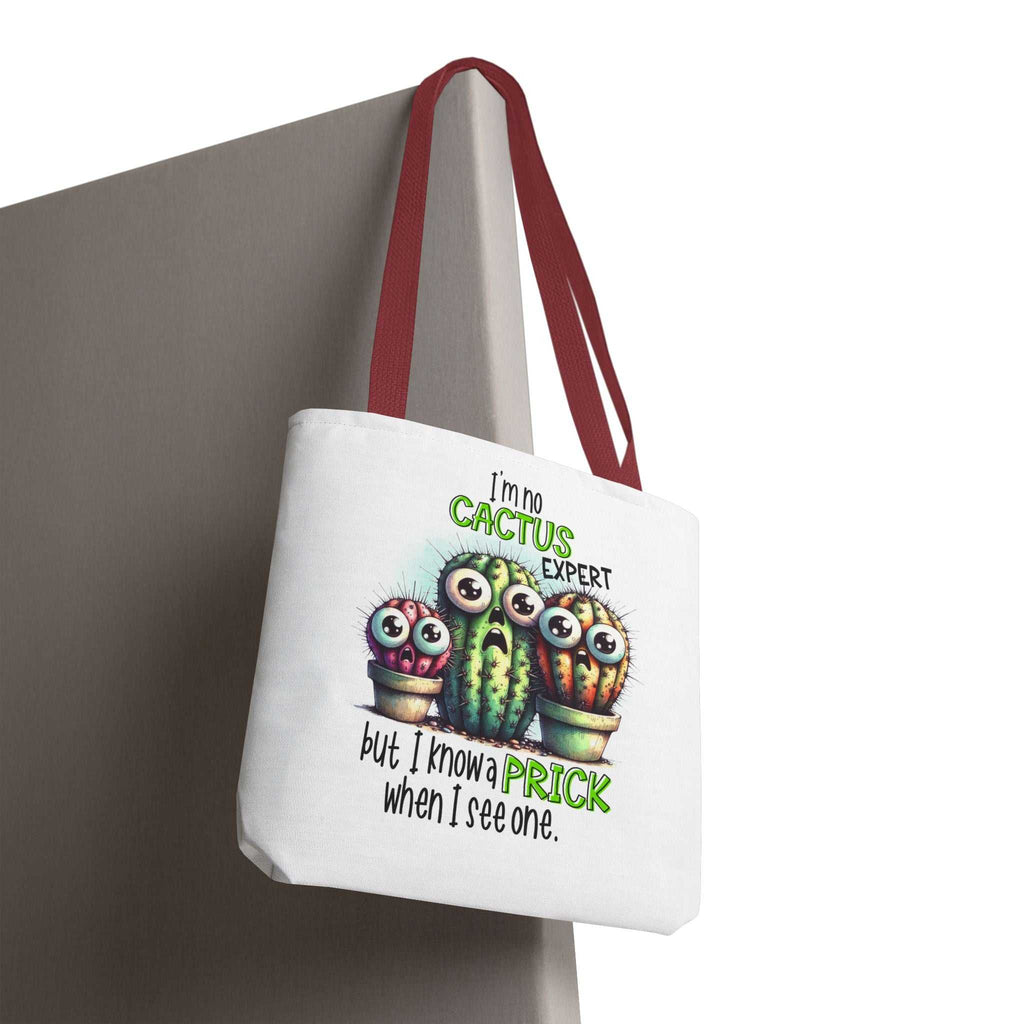 Fun cactus tote bag with cheeky design, available in three sizes and five handle colors, made from durable spun polyester.