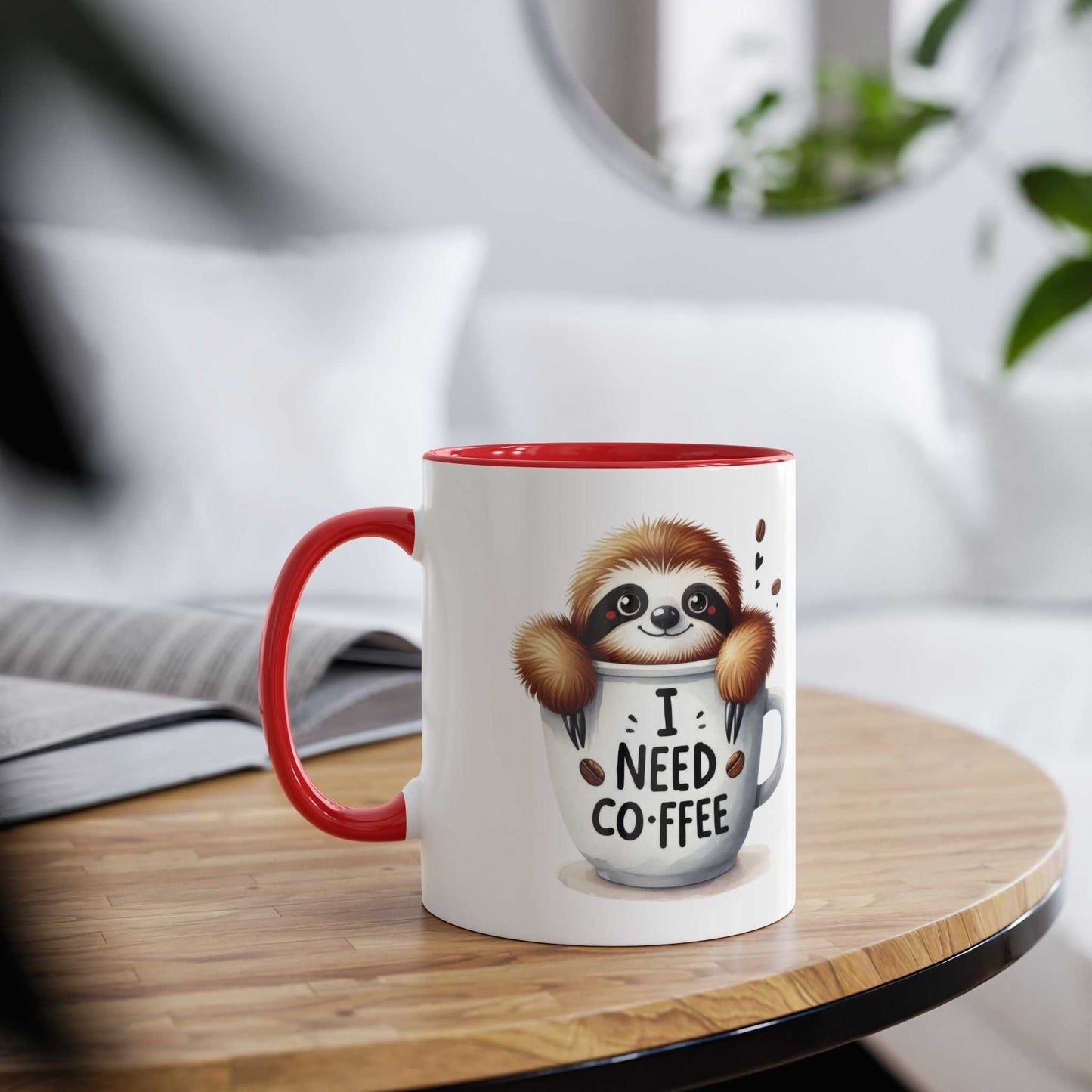 Cute sloth coffee mug with red handle on a wooden table.