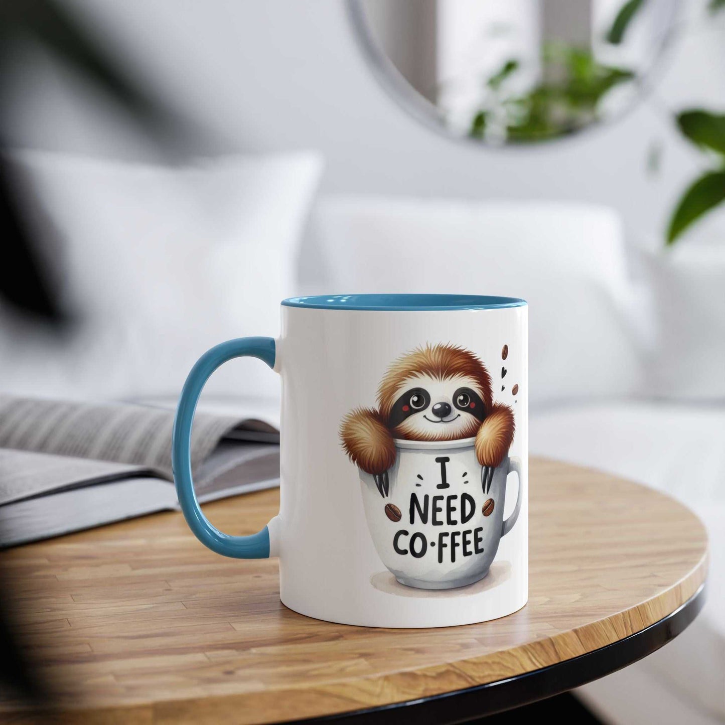 Cute sloth coffee mug with "I Need Coffee" design on table.