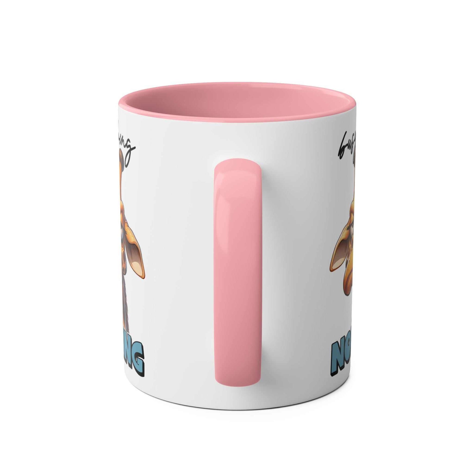 Giraffe coffee mug with pink handle, busy doing nothing design, 11oz ceramic, microwave and dishwasher safe.