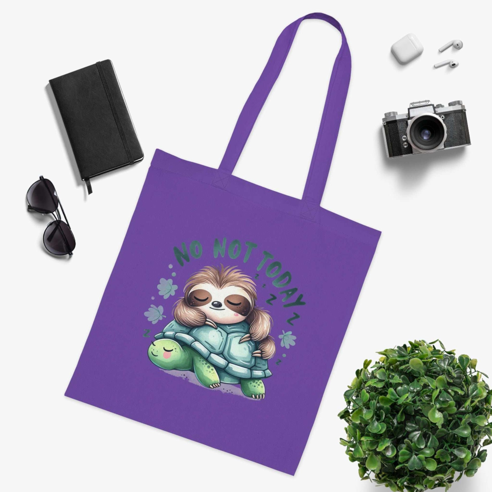 Cute sloth tote bag with vibrant colors, cotton fabric, and reinforced handles, perfect for stylish carrying.