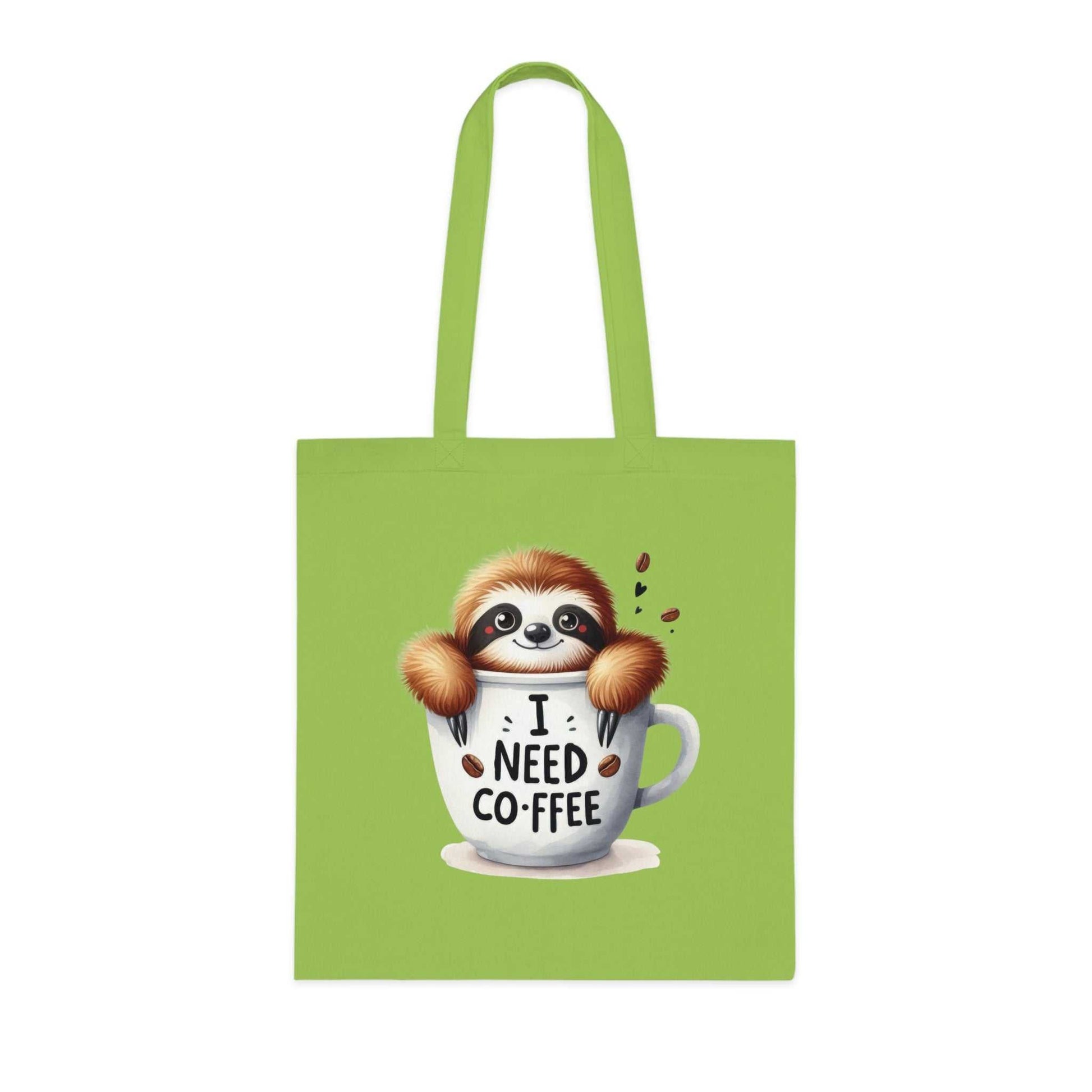 Cute sloth tote bag with "I Need Coffee" design on green cotton fabric.