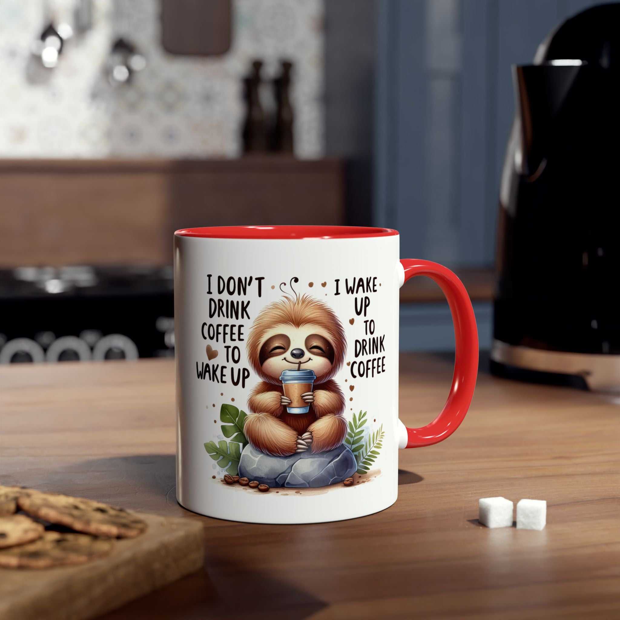 Cute sloth coffee mug in kitchen setting with text saying "I don't drink coffee to wake up, I wake up to drink coffee."