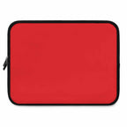 Red neoprene laptop sleeve with dual zipper, soft foam lining, lightweight and waterproof design.