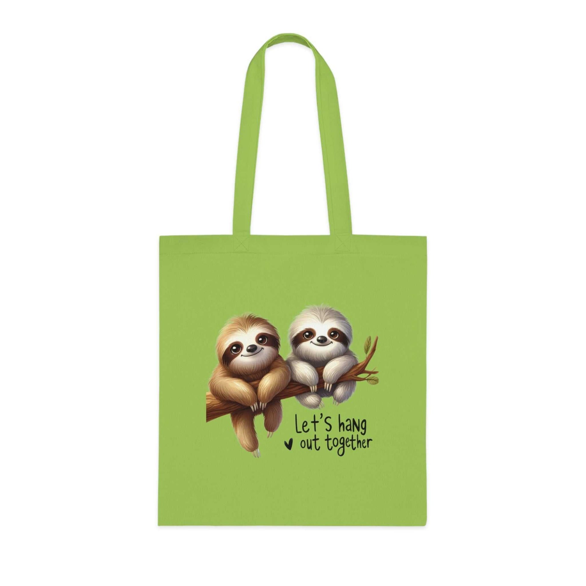 Cute sloth design on green cotton tote bag with reinforced handles.