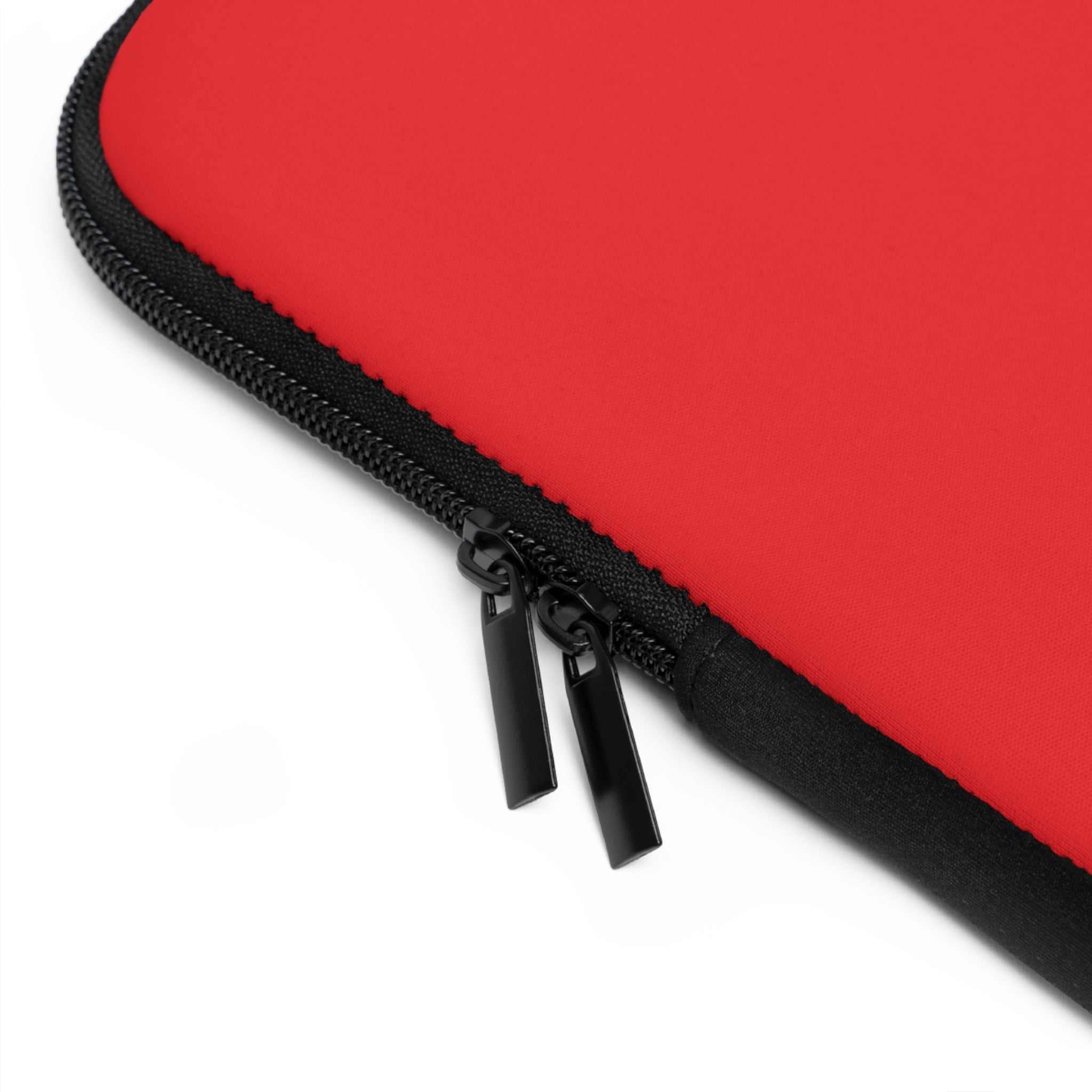 Red neoprene laptop sleeve with dual zipper and soft foam lining for protection
