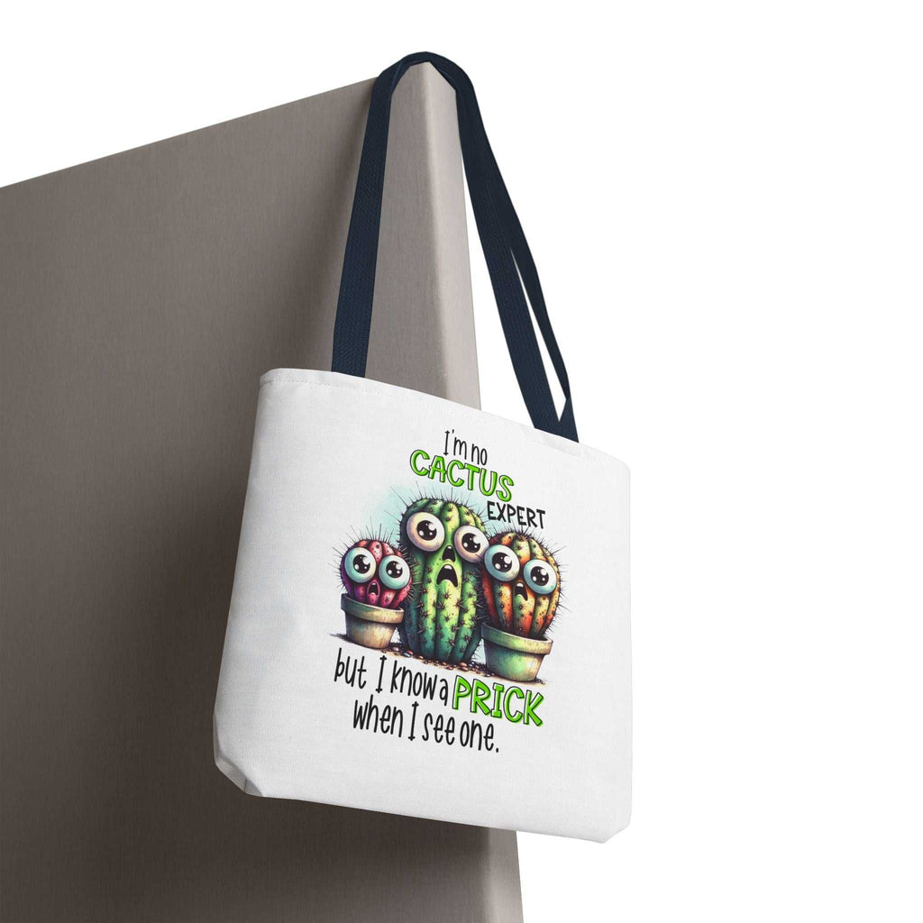 Fun cactus tote bag with cheeky printed design, durable spun polyester, and multiple handle color options.