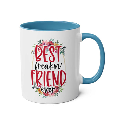 Best Freaking Friend Coffee Mug with floral design, blue handle, and text "Best freakin' friend ever".