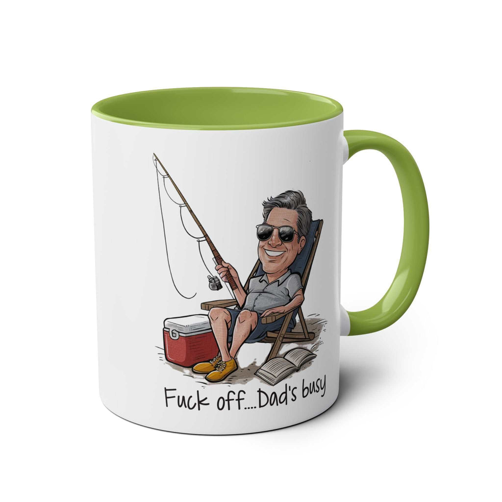Fun Fathers Day Gift Mug with humorous fishing illustration and green handle.