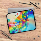 Colorful geometric pride design laptop sleeve with neoprene protection on wooden desk