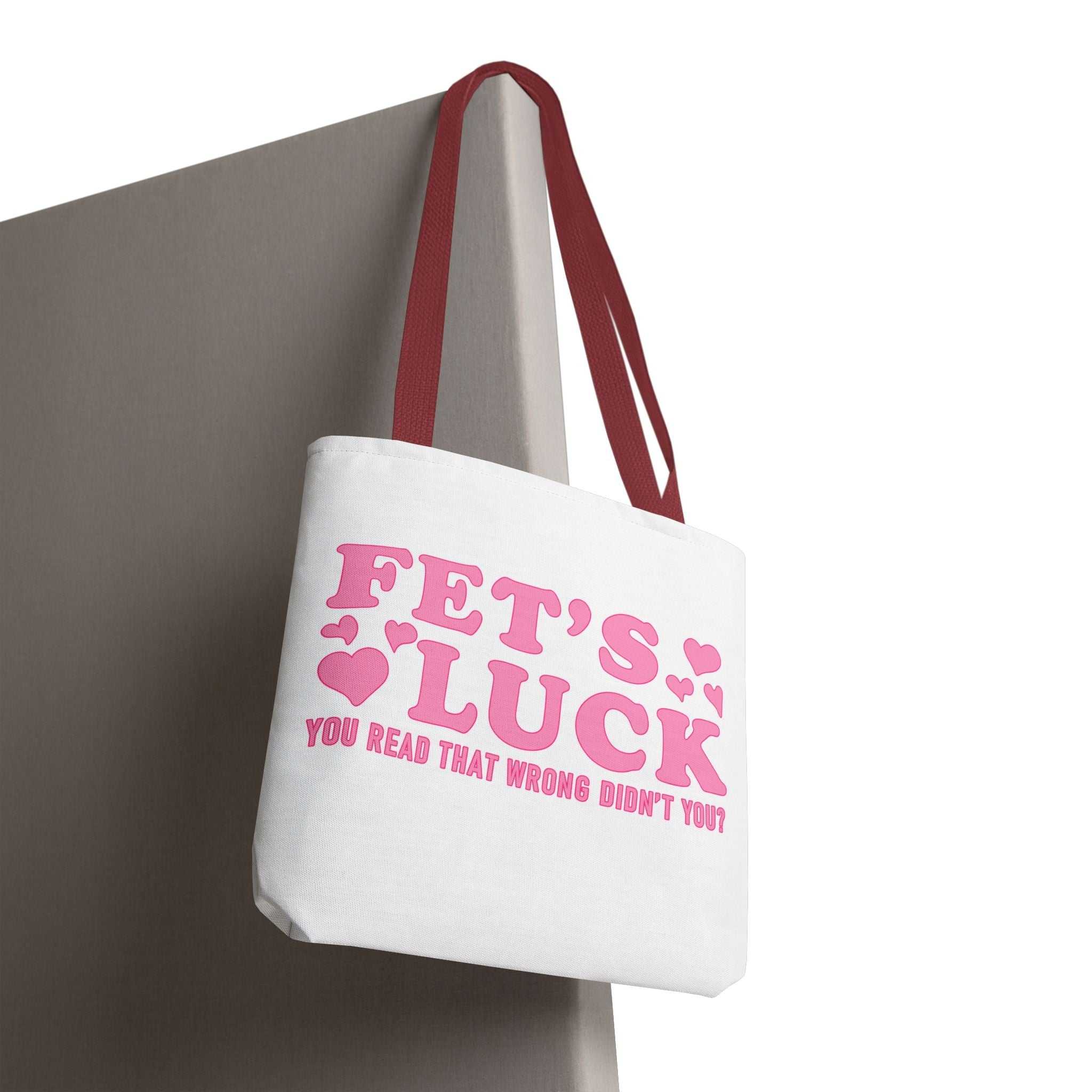 Pink heart tote bag with cheeky fun design and multiple handle color options