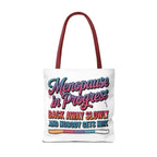 Menopause in Progress tote bag with cheeky design, durable polyester, multiple sizes and handle colors, lightweight and reusable