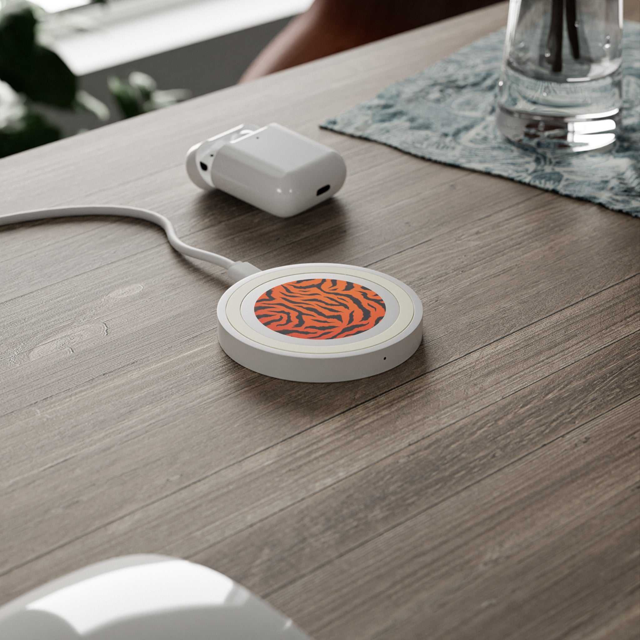 Orange Tiger Print wireless charging pad with 5W power and compact design on wooden table