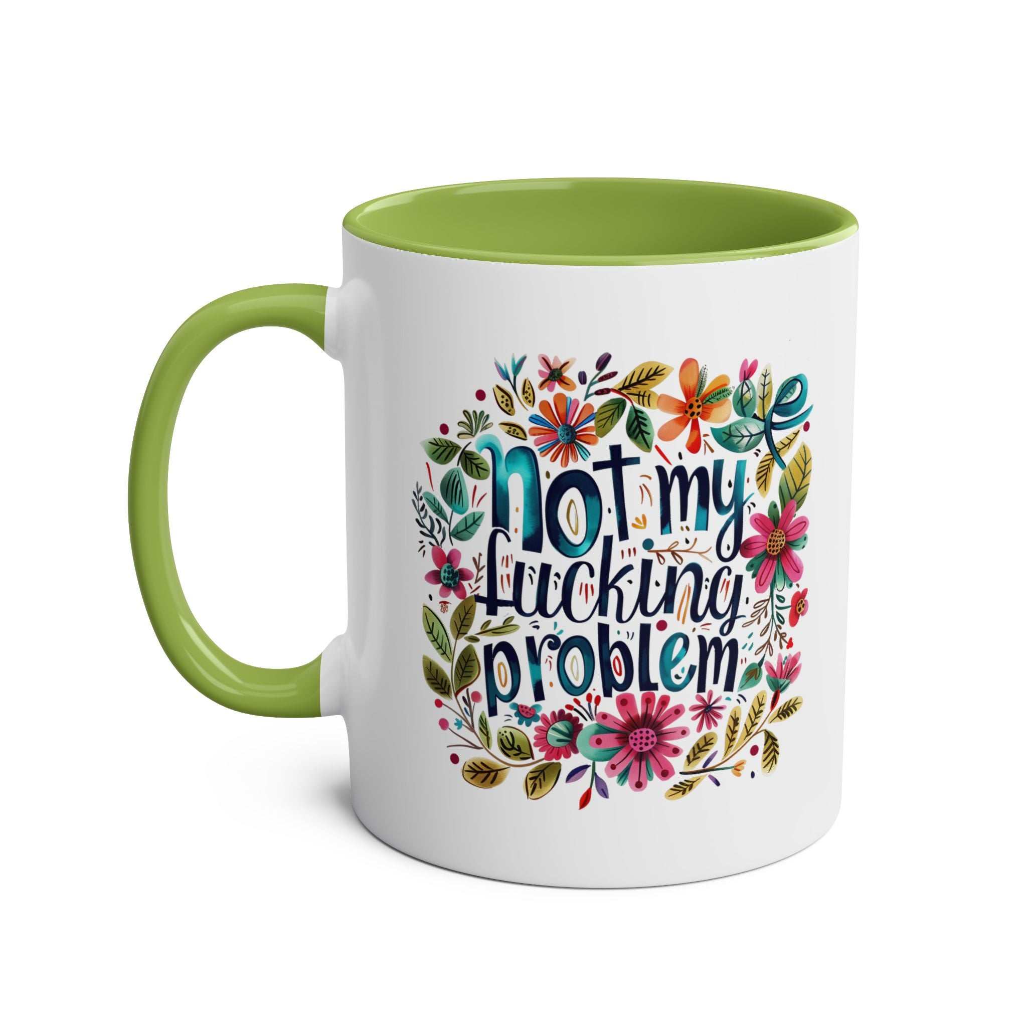 Colorful "Not My Problem" coffee mug with floral design and green interior.