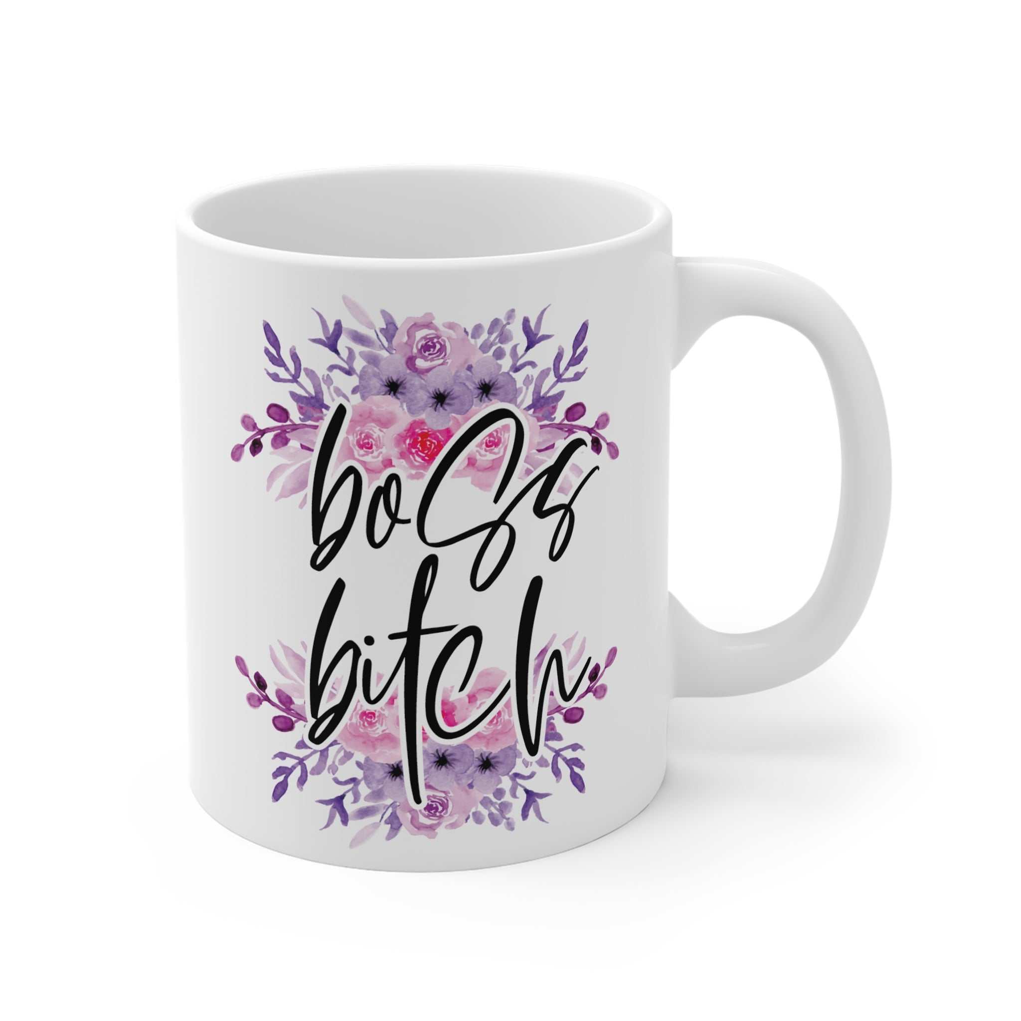 White ceramic mug with "boss bitch" text surrounded by purple and pink floral design, glossy finish, 11oz size.
