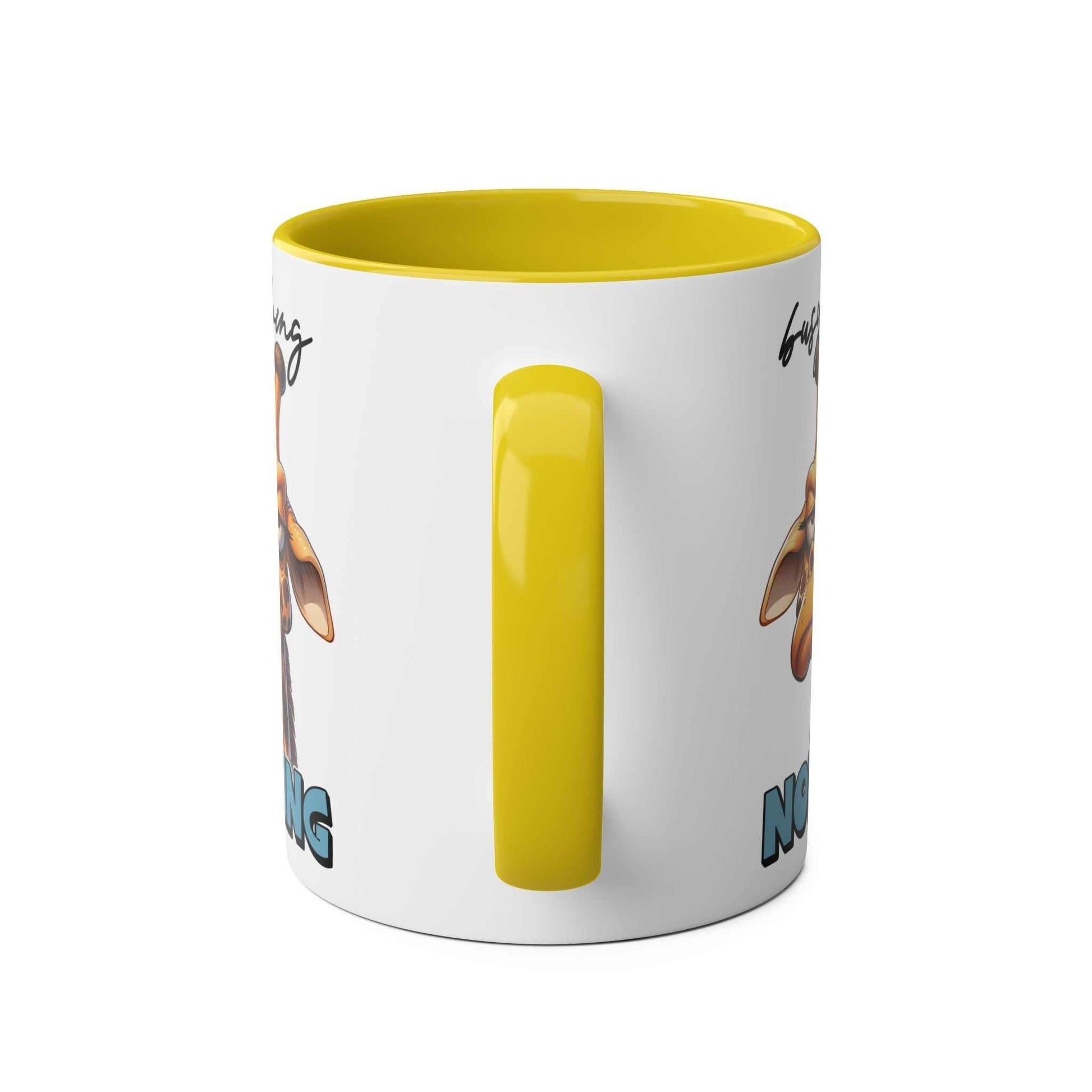 Giraffe design coffee mug with "Busy Doing Nothing" text, yellow handle and interior, microwave and dishwasher safe, 11oz ceramic.