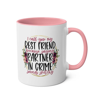 Partner in Crime Coffee Mug with humorous text and floral design, pink handle and interior, 11oz ceramic, microwave and dishwasher safe.