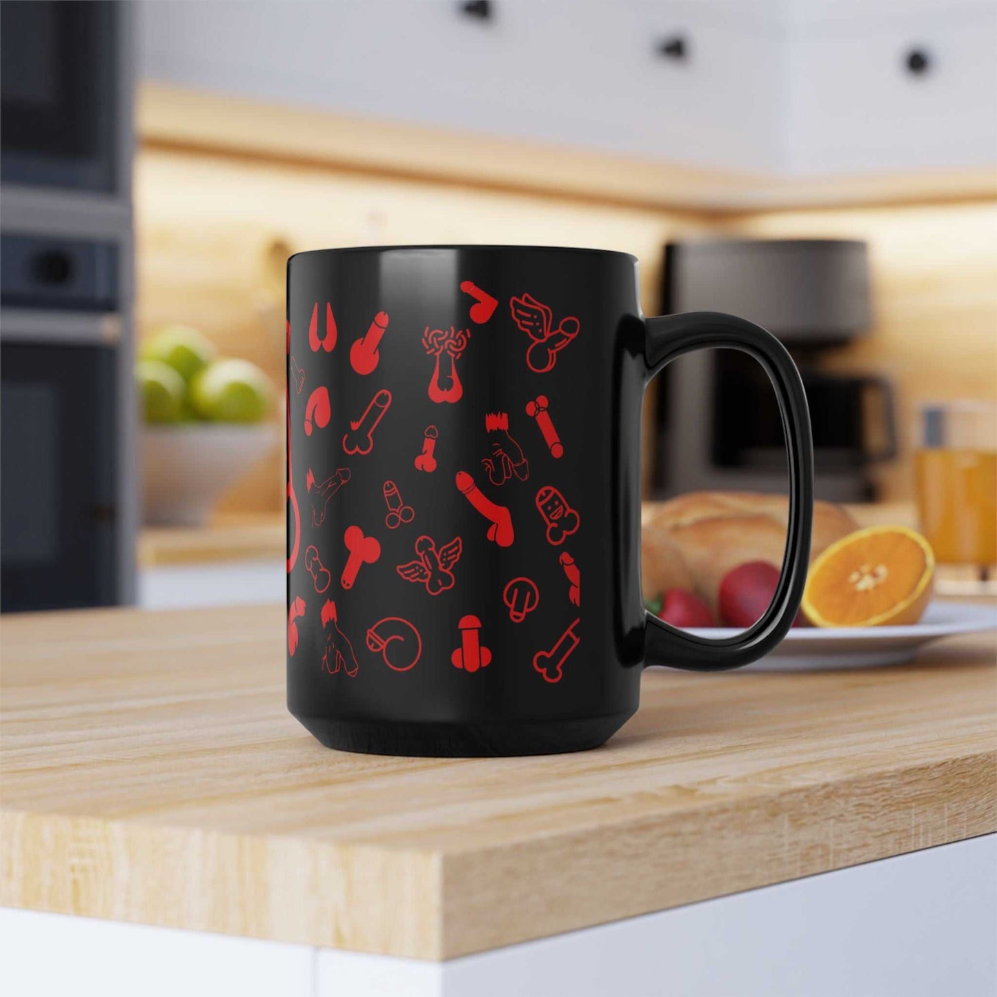 Black ceramic mug with playful red designs, available in two sizes, glossy finish, dishwasher and microwave safe.