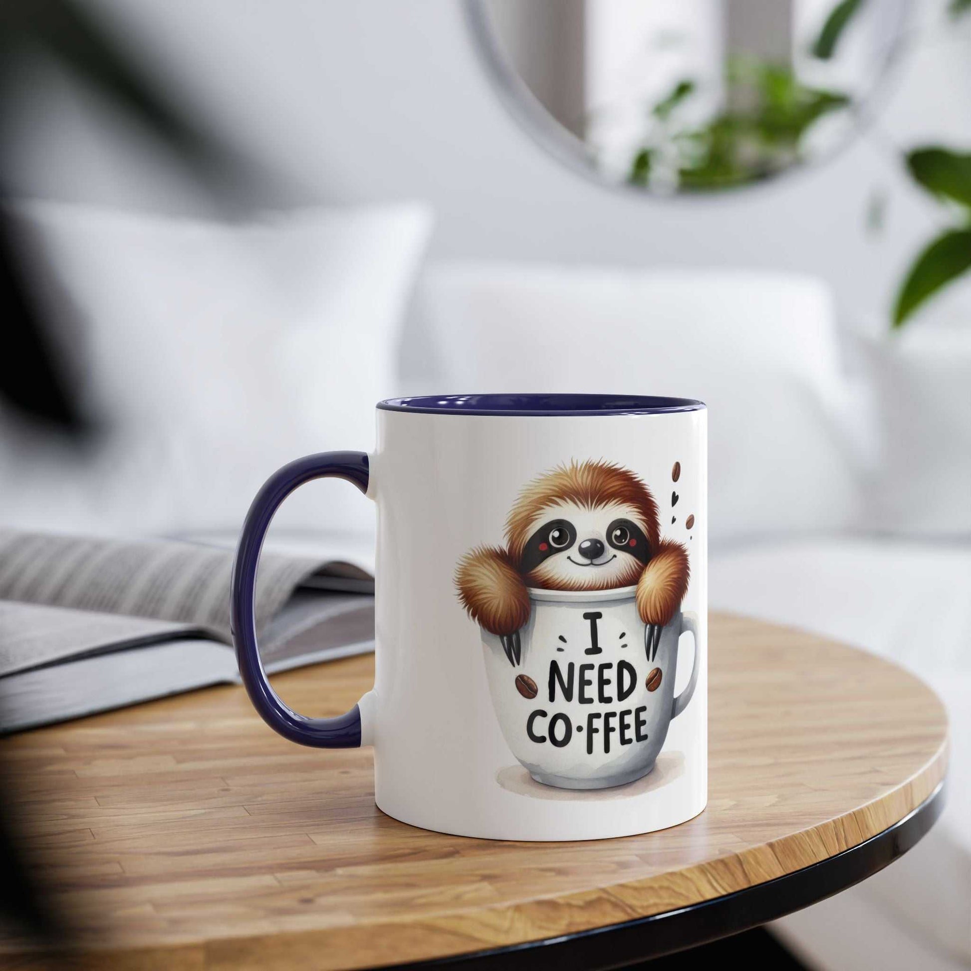 Cute sloth coffee mug with "I Need Coffee" design on a wooden table.