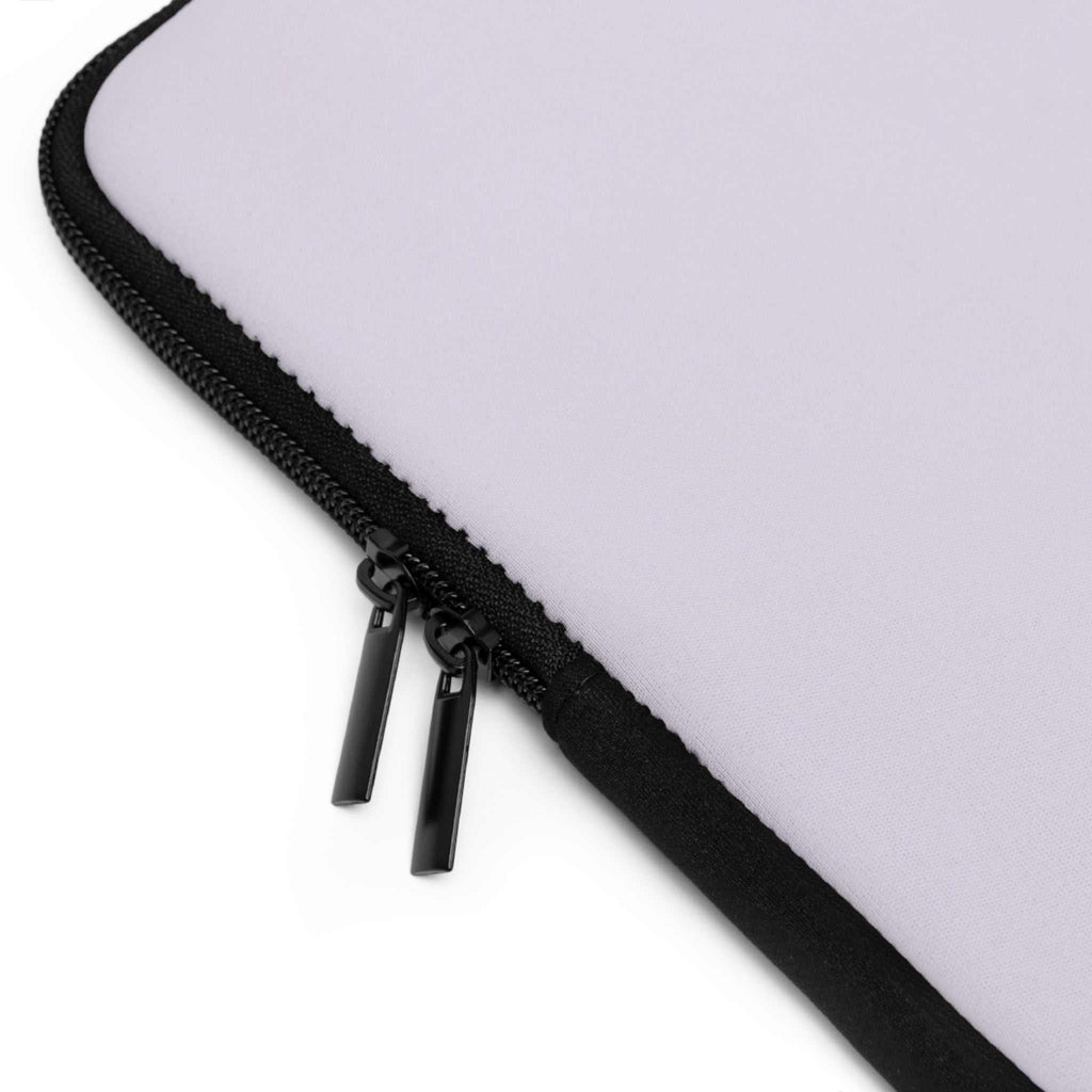 Close-up of lavender laptop sleeve with black dual zipper and neoprene material