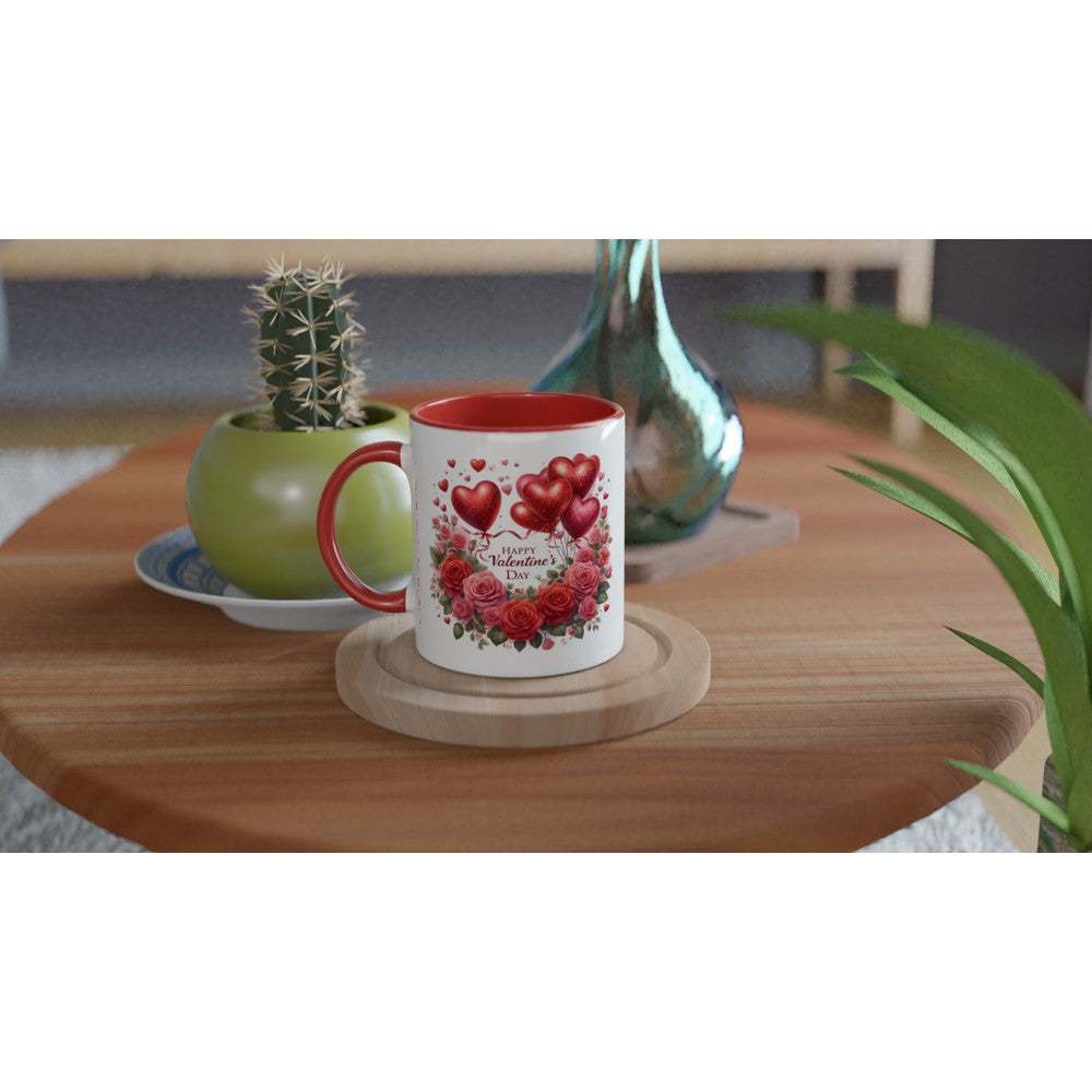 Valentines Day ceramic mug with red interior and handle, featuring heart design on a wooden table.