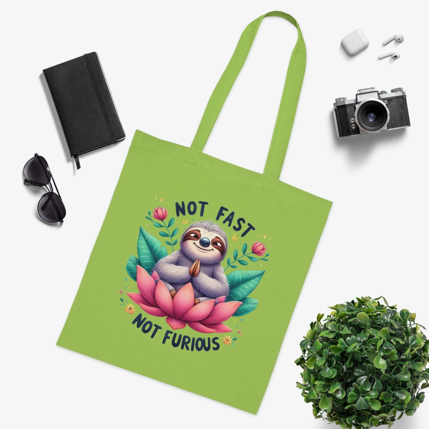 Cotton tote bag with cute sloth design, vibrant colors, 100% cotton, perfect for sloth lovers.