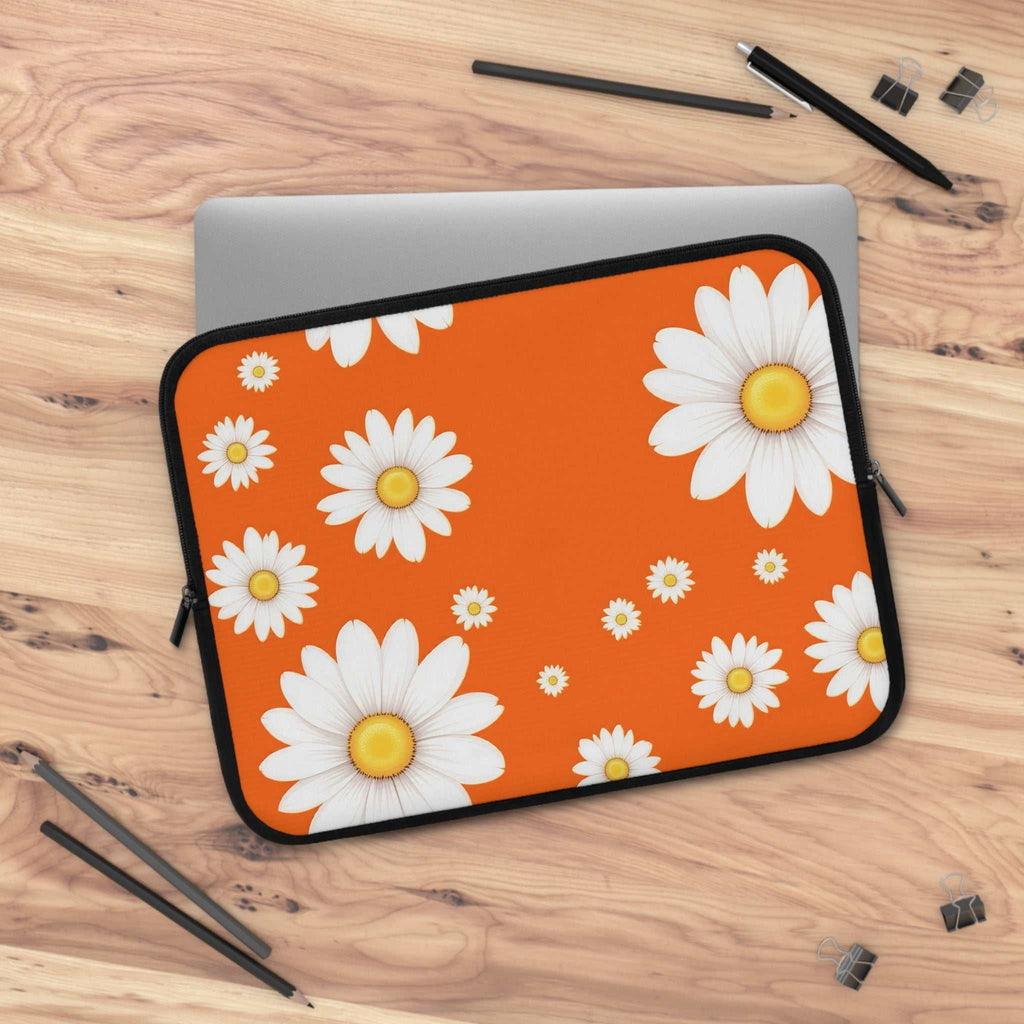 Orange daisy laptop sleeve with bright floral design, neoprene material, and dual zipper protection for laptops