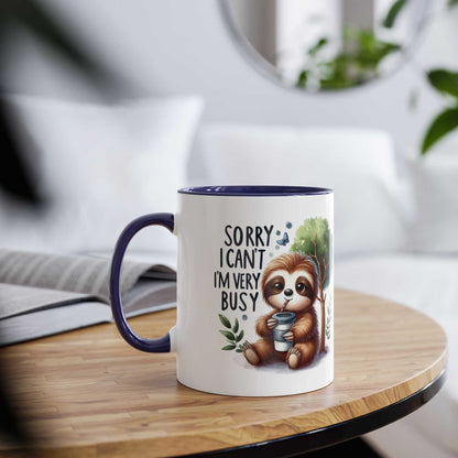 Cute sloth coffee mug with whimsical design on a wooden table.