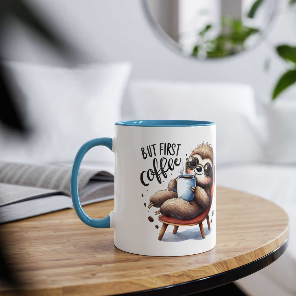 Cute sloth coffee mug with blue handle on a wooden table, perfect for animal lovers.