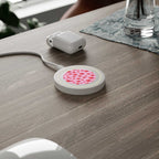 Pink Hearts Design wireless charging pad with 5W power and compact 7cm diameter on wooden desk