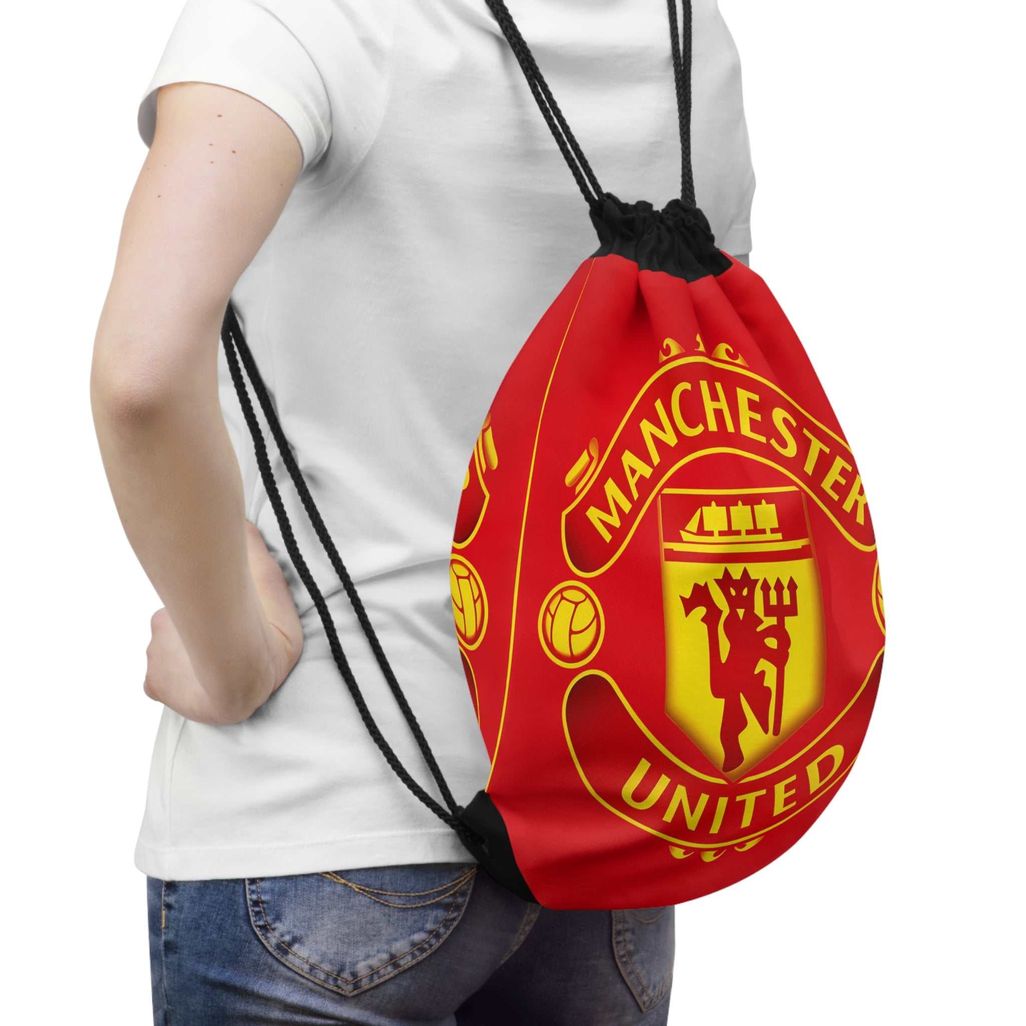 Manchester United drawstring bag in red and black with club crest, lightweight polyester, secure closure, and spacious interior for gym or travel