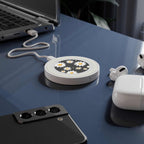 Black Daisy Design wireless charging pad with daisy pattern on desk charging smartphone and earbuds
