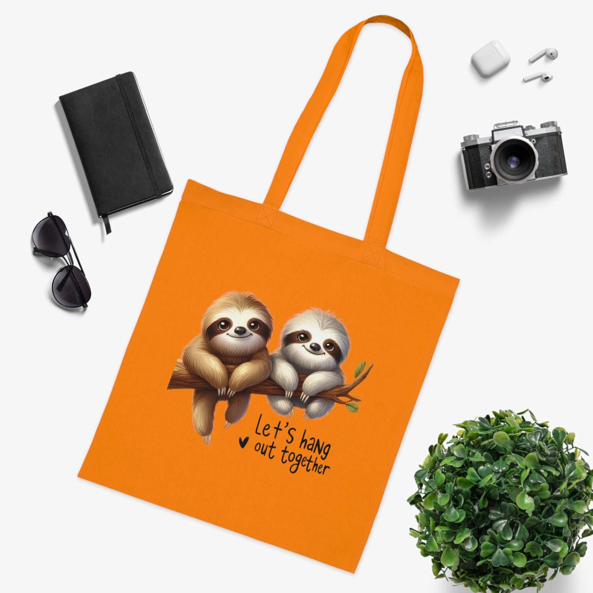 Cute sloth design cotton tote bag with vibrant colors for stylish carrying.