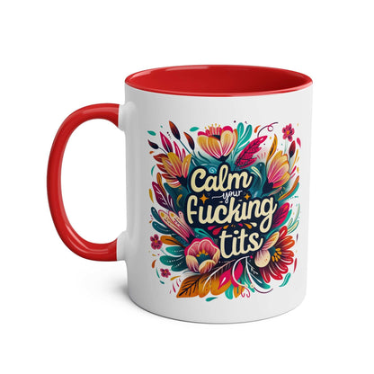 Colorful "Calm Your Tits" coffee mug with floral design and red handle.
