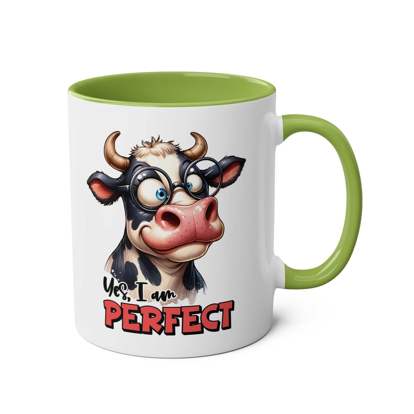 I Am Perfect Coffee Mug with quirky cow design and green handle.