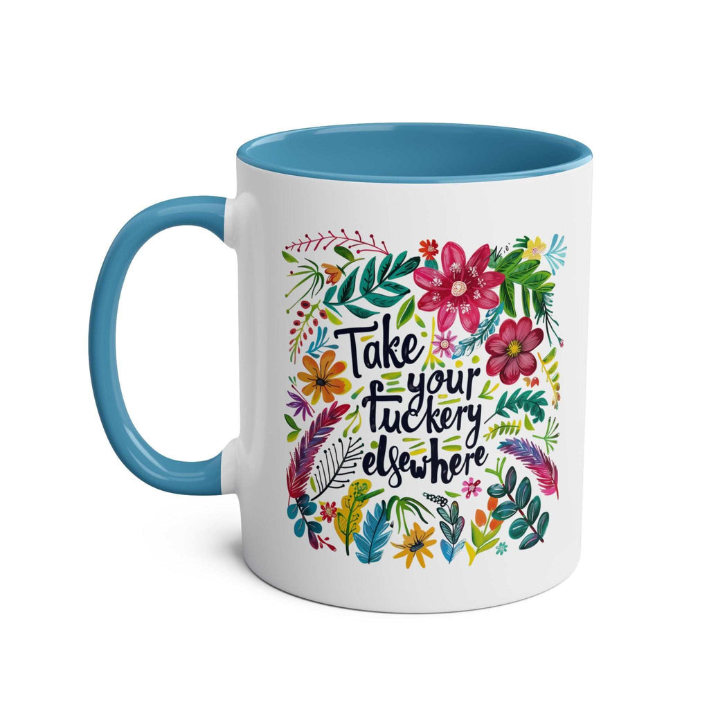 Take your fuckery elsewhere coffee mug with floral design and blue handle.