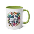 Not My Problem Coffee Mug with floral design, green handle, and cheeky statement.