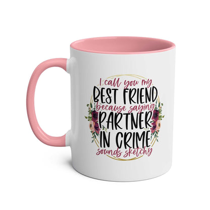 Partner in Crime Coffee Mug with humorous best friend quote, pink handle, and floral design.