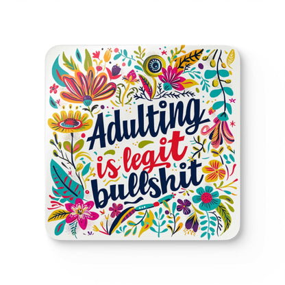 Colorful floral coaster with "Adulting Is Legit Bullshit" text, part of a playful coaster set.