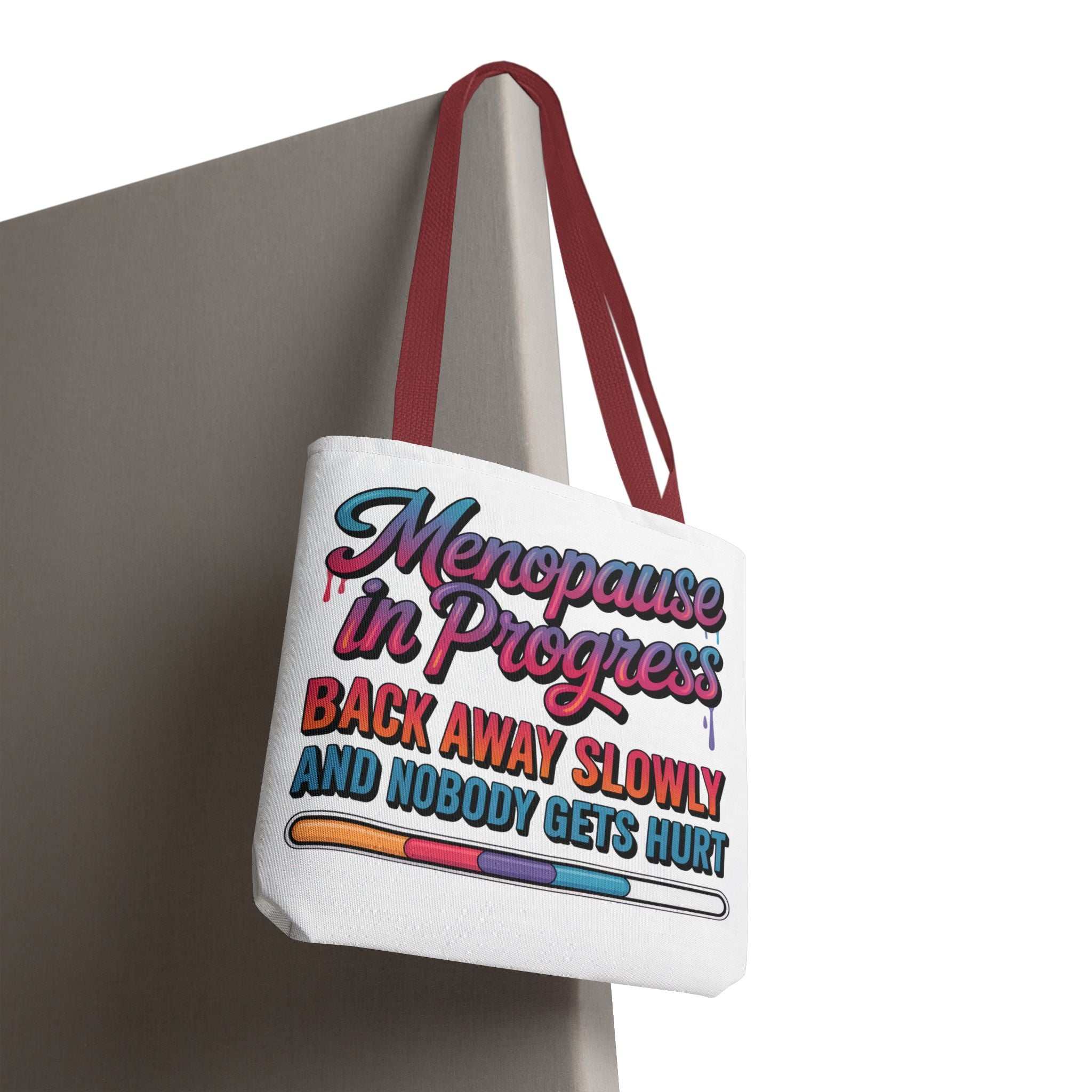 Menopause in Progress tote bag with cheeky design, durable spun polyester, multiple sizes and handle colors, perfect for daily use
