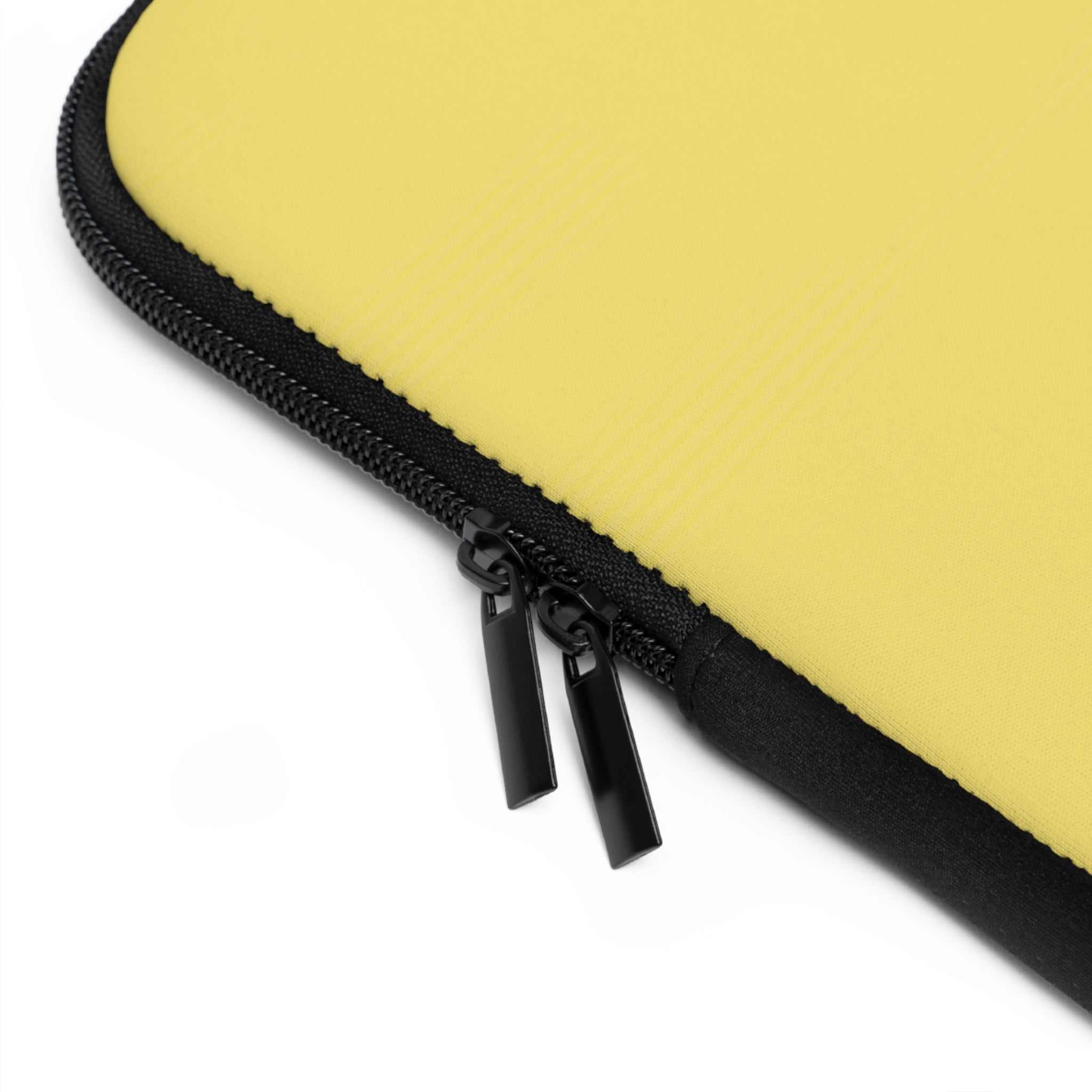 Close-up of lemon yellow neoprene laptop sleeve with dual black zipper and soft foam lining protection
