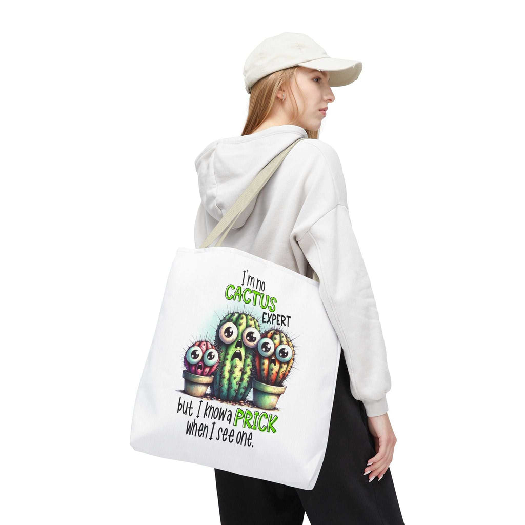 Fun cactus tote bag with cheeky design, durable spun polyester, multiple sizes and handle colors.