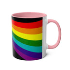 LGBTQ+ Pride mug with vibrant rainbow design, high-quality ceramic, pink handle, 11oz, microwave and dishwasher safe.